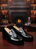 Penny loafers with a croc-embossed feature